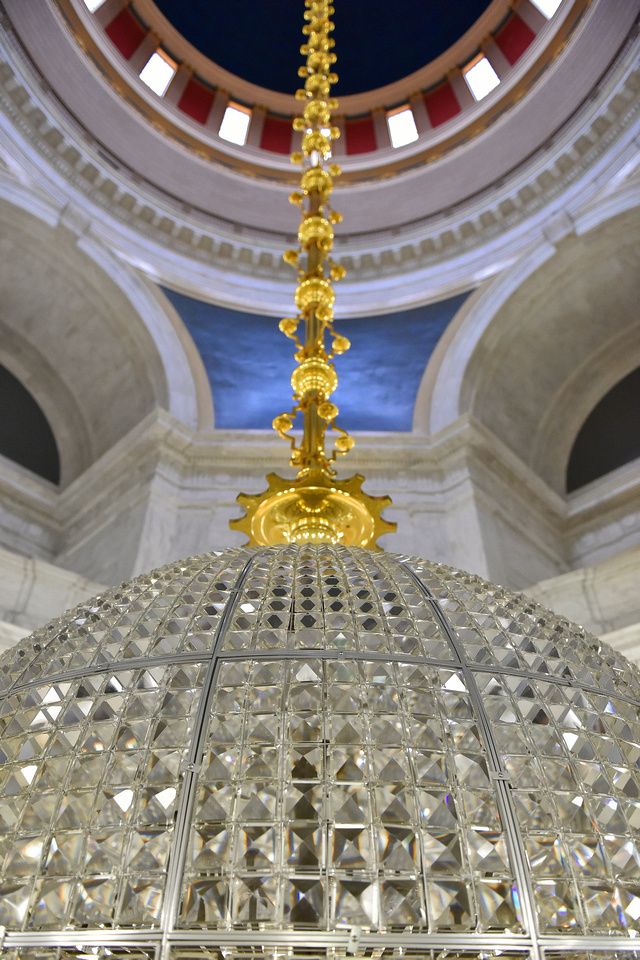 Image of chandelier lowered for cleaning in the West Virginia Capitol Rotunda.